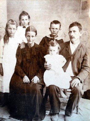 The Long family. Standing, Ray, Mary, Archie. Seated, ?, ? and baby Ruby