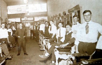 Second from right (standing) in bow tie , Charlie Benskin in barber school
